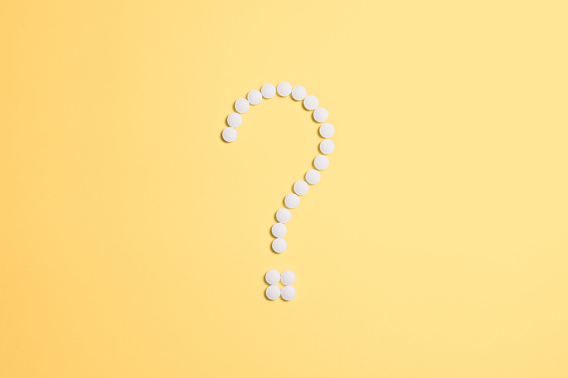 white beads on question mark sign